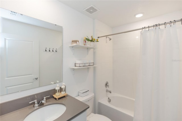 full bathroom featuring vanity, toilet, and shower / bath combo with shower curtain