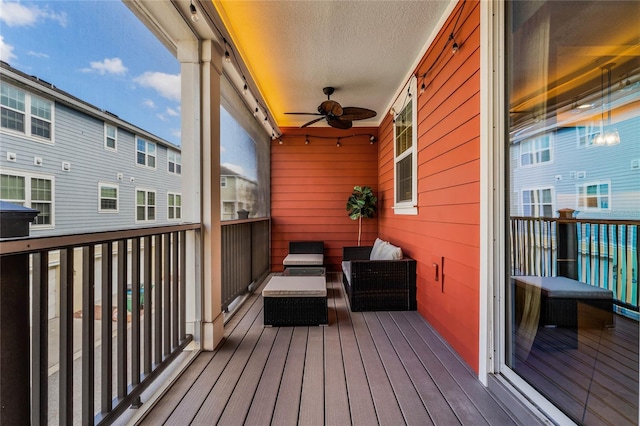 deck with ceiling fan and an outdoor hangout area