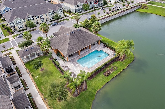 birds eye view of property featuring a water view