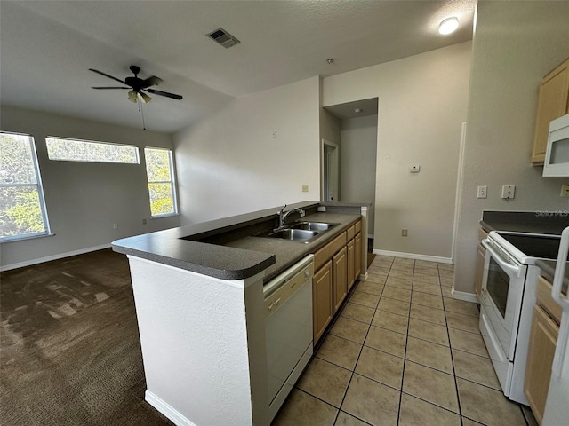 kitchen with lofted ceiling, tile patterned floors, sink, white appliances, and light brown cabinets