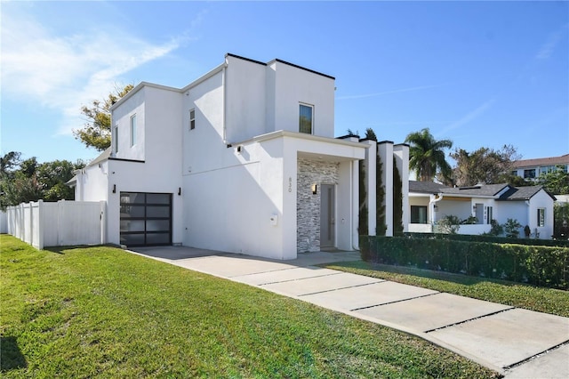 contemporary home with a front lawn