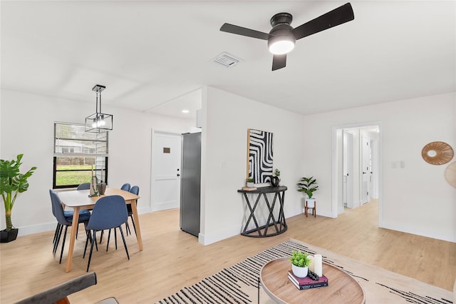 dining room featuring ceiling fan and light wood-type flooring