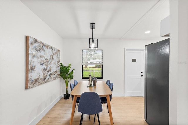 dining room with light hardwood / wood-style floors