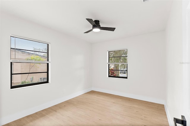 empty room with light hardwood / wood-style floors and ceiling fan