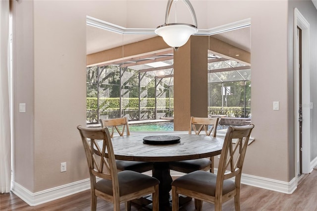 dining area with wood-type flooring