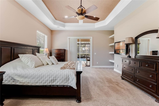 bedroom with access to outside, ceiling fan, a tray ceiling, and light carpet