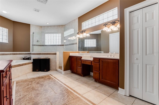 bathroom with separate shower and tub, tile patterned flooring, and vanity