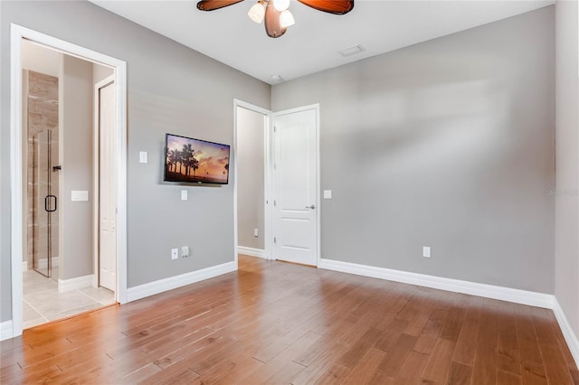 unfurnished room featuring light hardwood / wood-style floors and ceiling fan