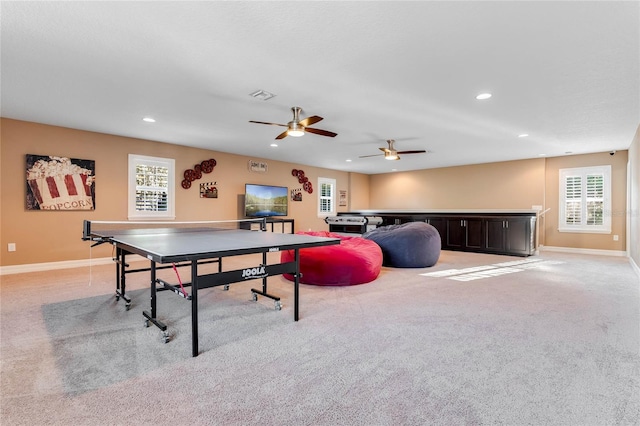 game room featuring ceiling fan and light colored carpet