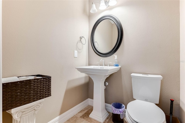 bathroom featuring tile patterned floors and toilet