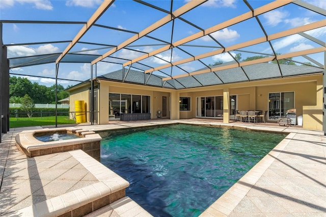 view of swimming pool featuring a lanai, a patio area, and an in ground hot tub