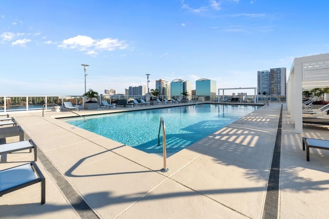 view of swimming pool with a patio area