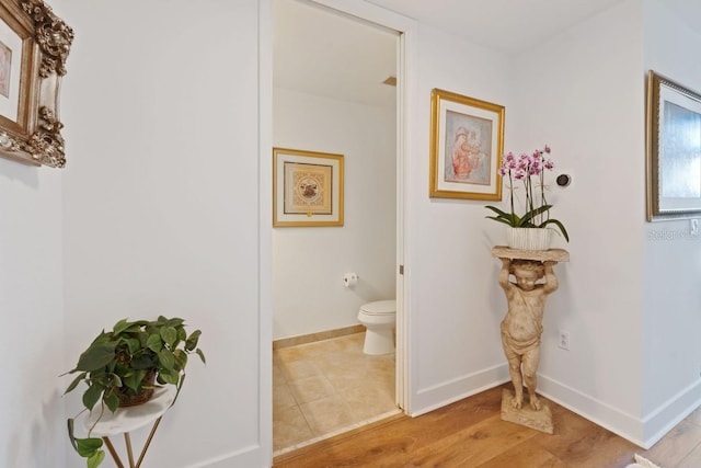 hall with light hardwood / wood-style floors