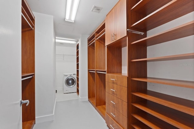 walk in closet featuring washer / dryer