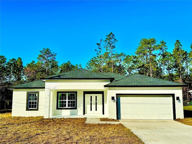 view of front of house featuring french doors and a garage