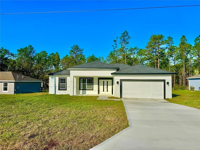 view of front of home featuring a garage, a front yard, concrete driveway, and stucco siding