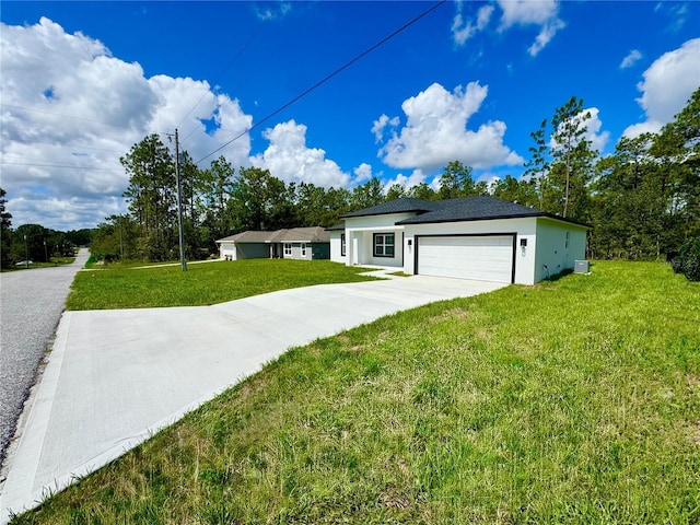 7362 N Everest Ter, Citrus Springs, FL 34434 - view of front facade with driveway, a front lawn, a garage, and stucco siding
