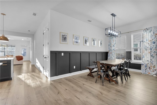 dining area featuring light wood-type flooring