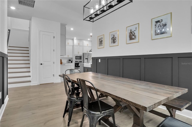 dining space featuring light hardwood / wood-style flooring