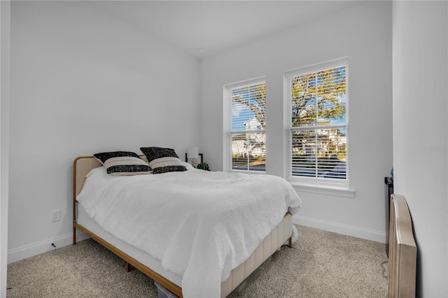 bedroom with light carpet