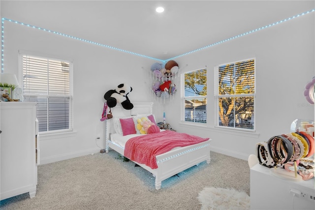 bedroom with light carpet