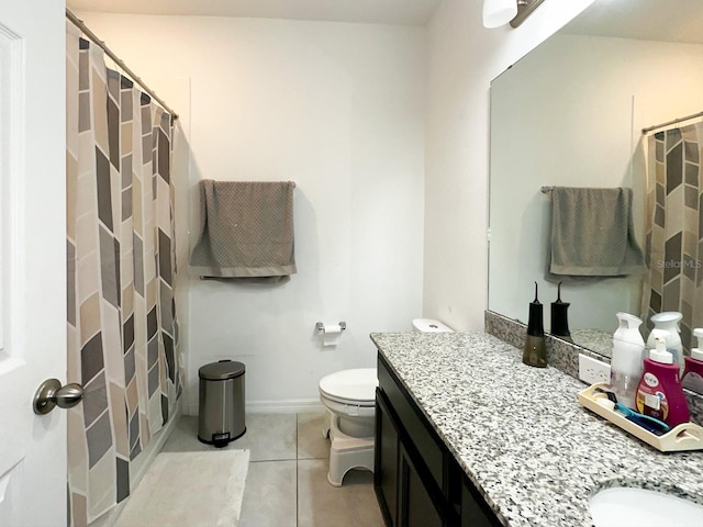 bathroom featuring vanity, toilet, tile patterned floors, and a shower with curtain