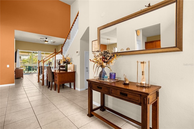 hall with light tile patterned floors