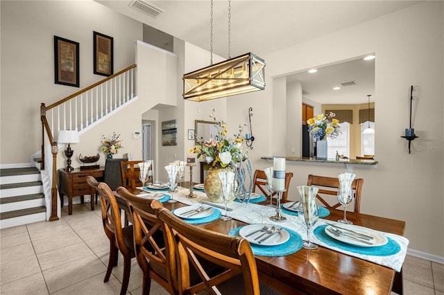 dining area featuring light tile patterned flooring