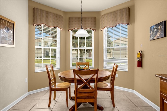 dining area featuring light tile patterned floors