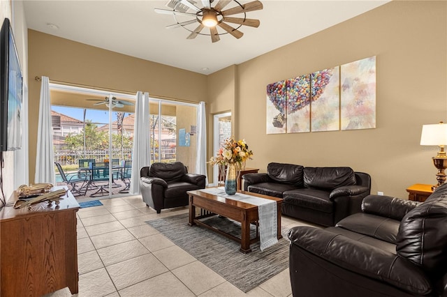 tiled living room with ceiling fan