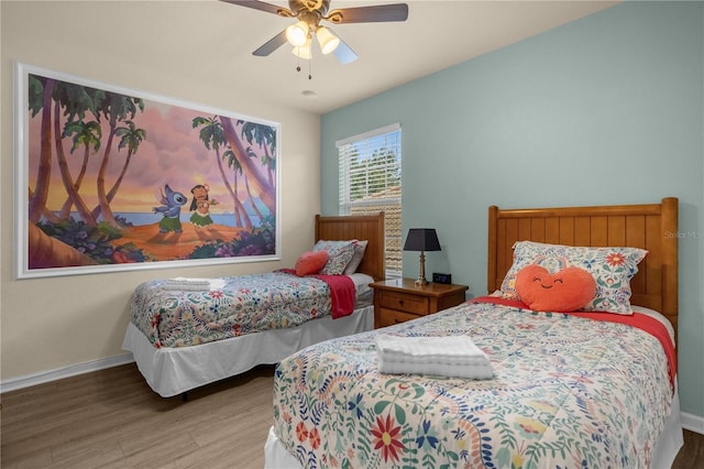 bedroom featuring hardwood / wood-style flooring and ceiling fan