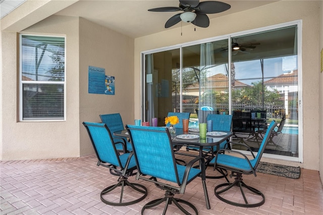 view of patio featuring ceiling fan