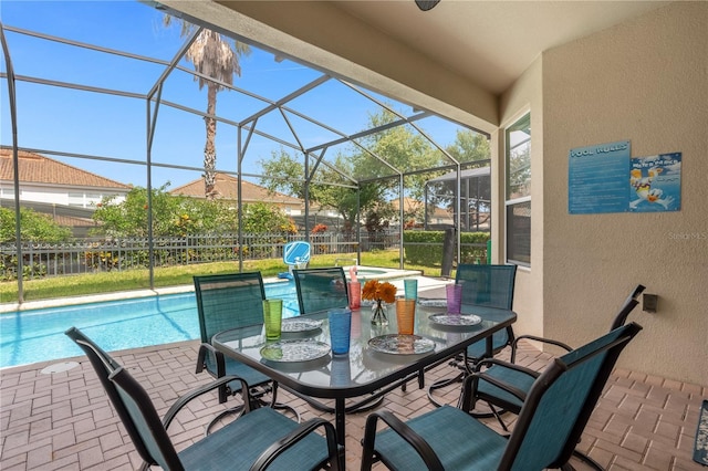 view of patio / terrace with a fenced in pool and glass enclosure