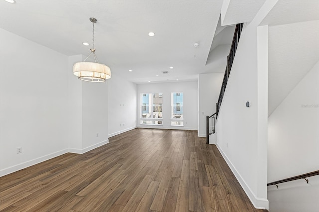 unfurnished living room featuring dark hardwood / wood-style floors