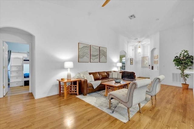 living room with light hardwood / wood-style flooring