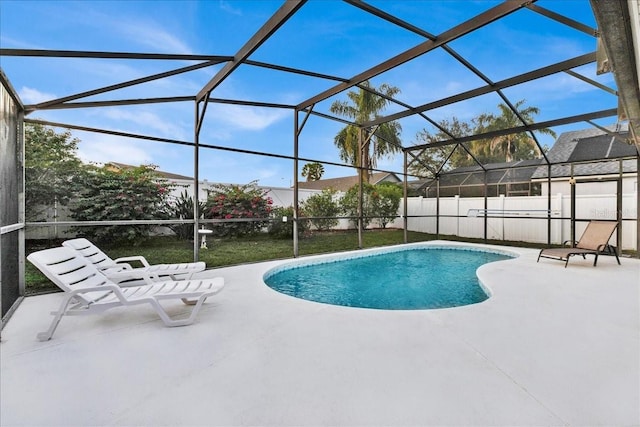 view of pool with a lanai and a patio