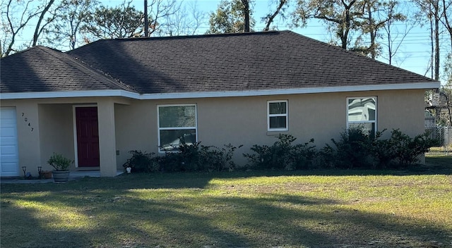 exterior space with a lawn and a garage