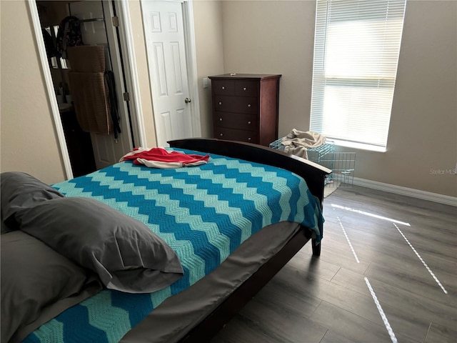 bedroom featuring hardwood / wood-style flooring and a closet