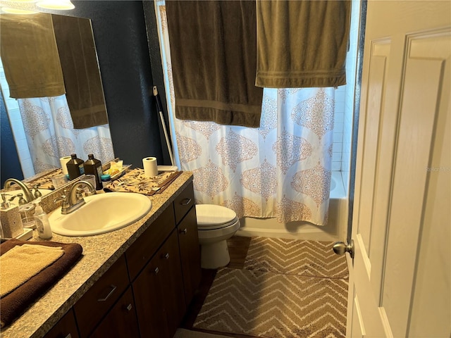 full bathroom featuring shower / bath combination with curtain, toilet, and vanity