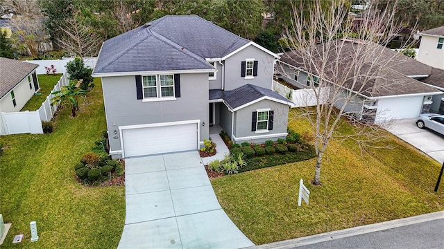 front facade with a front yard and a garage