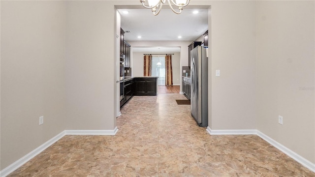 hallway with a chandelier