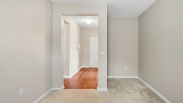 hallway with light carpet