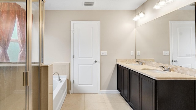 bathroom with vanity, shower with separate bathtub, and tile patterned floors