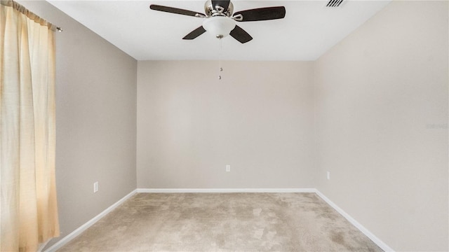 spare room featuring ceiling fan and carpet flooring