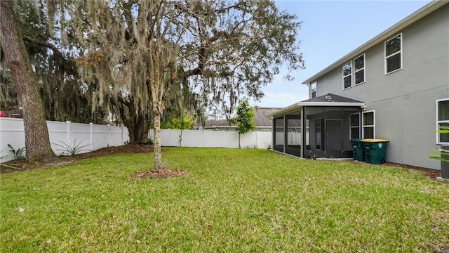 view of yard with a sunroom