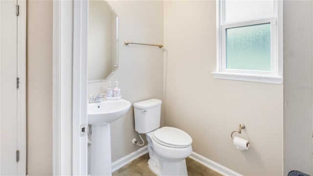 bathroom with toilet and sink