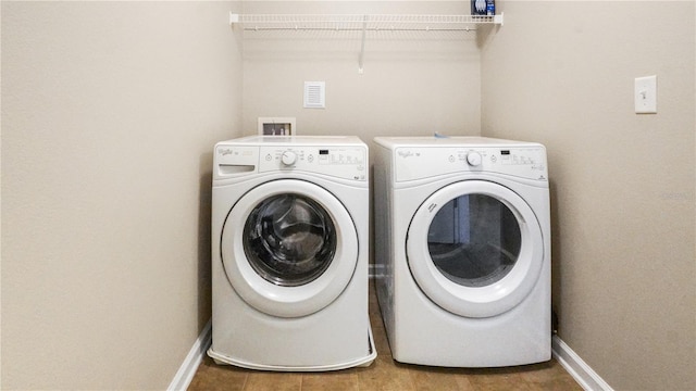 washroom featuring independent washer and dryer