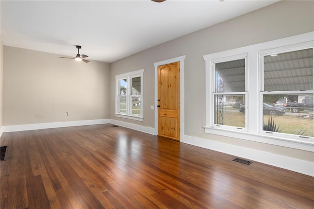 interior space with ceiling fan, dark hardwood / wood-style flooring, and a wealth of natural light