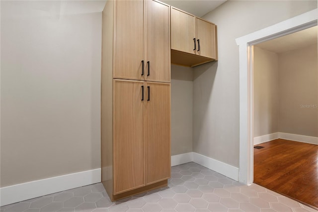 mudroom with light tile patterned flooring