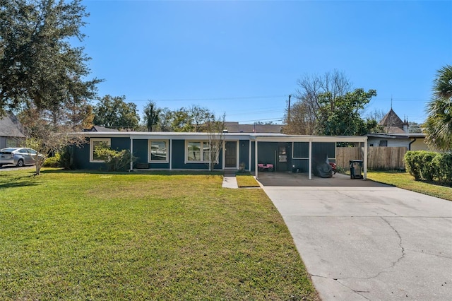 single story home with a front lawn and a carport